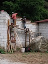 Wall cap being installed near front entry